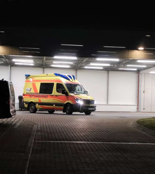 Ambulance at night near station